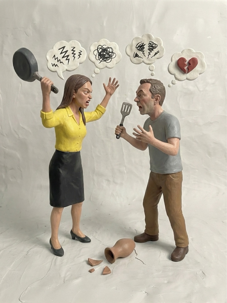 Clay sculpture of an arguing couple